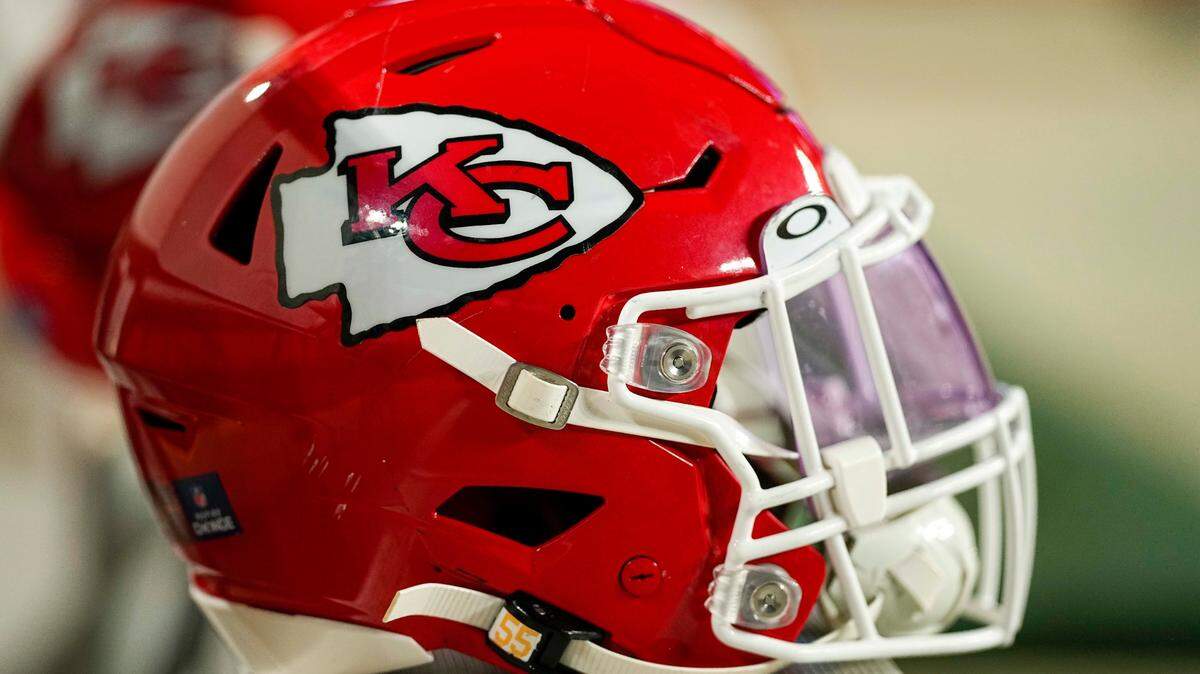 A Kansas City Chiefs helmet sits on the bench during an NFL football game against the Denver Broncos Saturday, Jan. 8, 2022, in Denver. (AP Photo/Jack Dempsey)