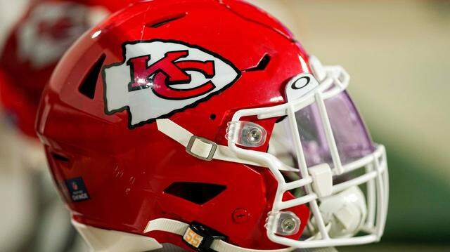 A Kansas City Chiefs helmet sits on the bench during an NFL football game against the Denver Broncos Saturday, Jan. 8, 2022, in Denver. (AP Photo/Jack Dempsey)