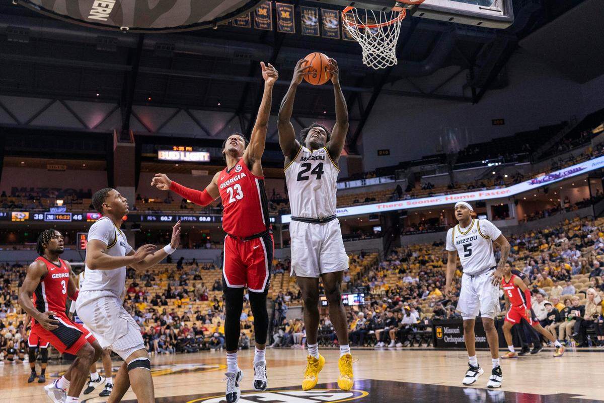 Missouri’s Kobe Brown, right, pulls down a rebound past Georgia’s Braelen Bridges, left, during the second half of an NCAA college basketball game Saturday, March 5, 2022, in Columbia, Mo. Missouri won 79-69. (AP Photo/L.G. Patterson)