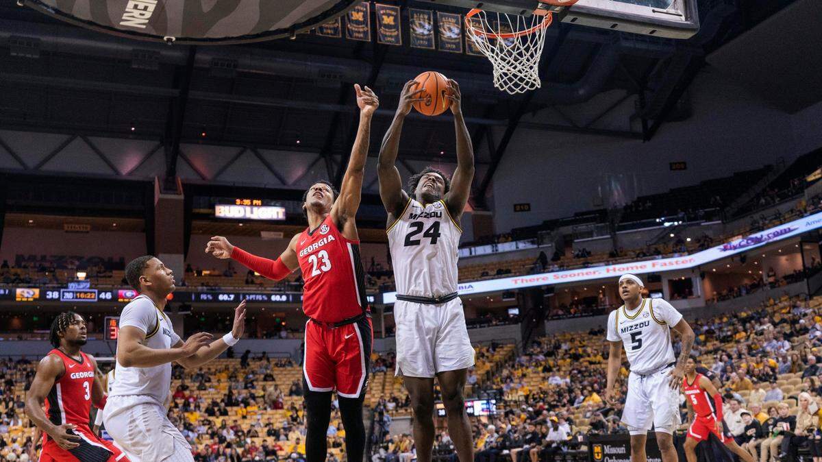 Missouri’s Kobe Brown, right, pulls down a rebound during a game against Georgia last season.
