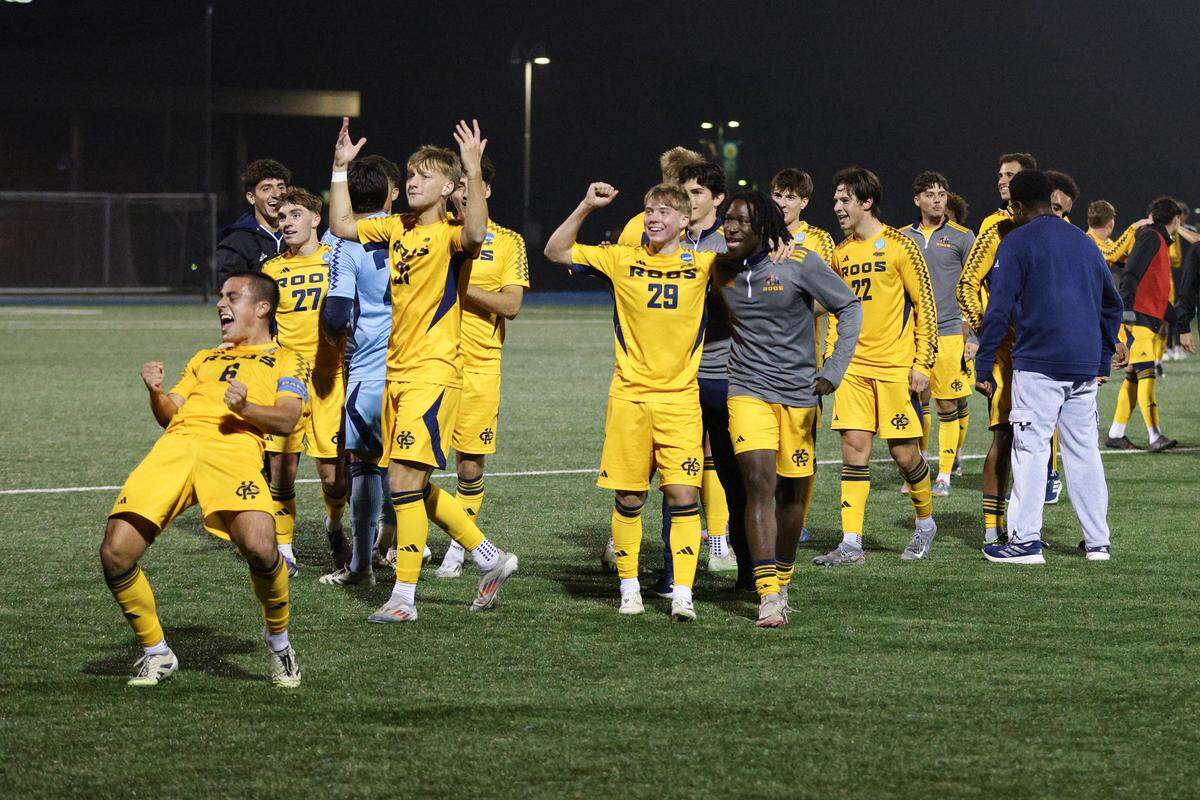 Kansas City Roos players celebrate their 1-0 victory over visiting Lindenwood University in a first-round NCAA Men’s Soccer Tournament match in Kansas City on Thursday, Nov. 20, 2025.