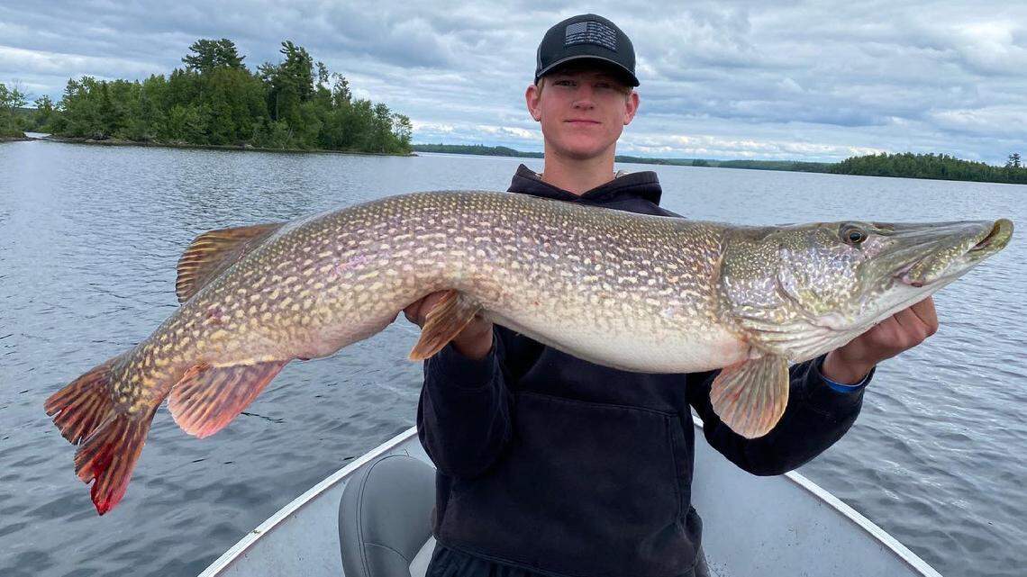  Brecken Kobylecky with the largest northern pike that has been caught and released in Minnesota. 