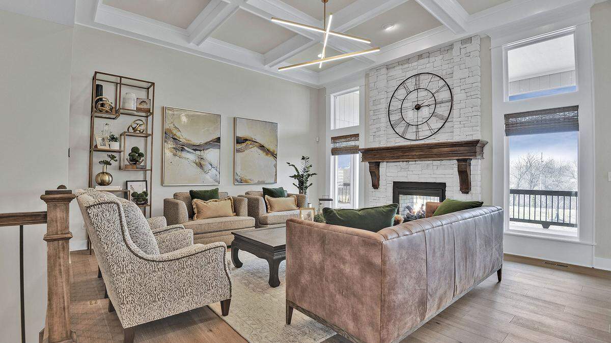 This popular reverse 1.5-story floor plan by James Engle Custom Homes LLC features a stunning, open entrance with soaring ceilings and a light-filled great room with a view of the see-thru fireplace to the covered deck, a gourmet kitchen and handsome primary suite. This stylish model can be viewed in the Willow Grove neighborhood and built in Willow Grove or Willow Pointe.
