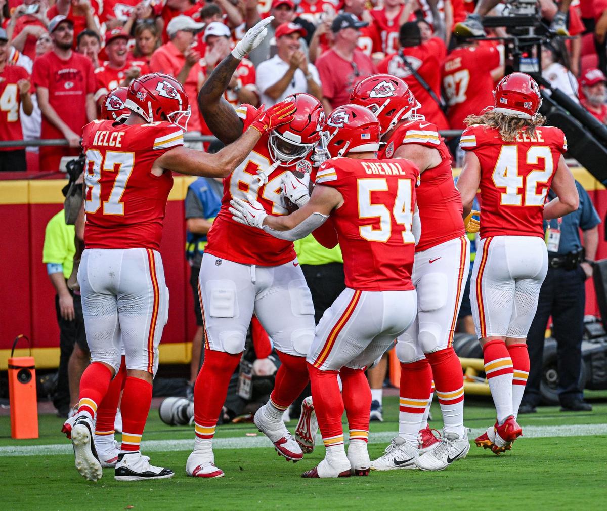 Teammates celebrate with Kansas City Chiefs offensive tackle Wanya Morris (64) after he caught a pass for a touchdown in the third quarter against the Cincinnati Bengals Sunday, Sept. 15, 2024, at GEHA Field at Arrowhead Stadium.