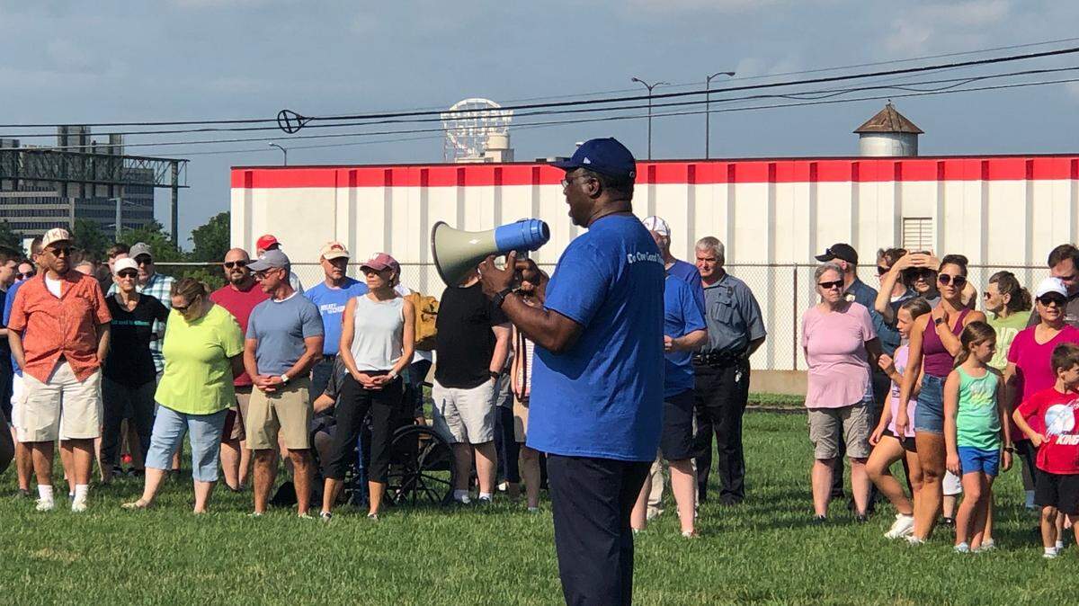 Walk for Unity participants listen to an introduction from Ray Jarrett, Unite KC Executive Director, at Troost Ave. and E. Truman Road in Kansas City on Saturday, June 17, 2021.