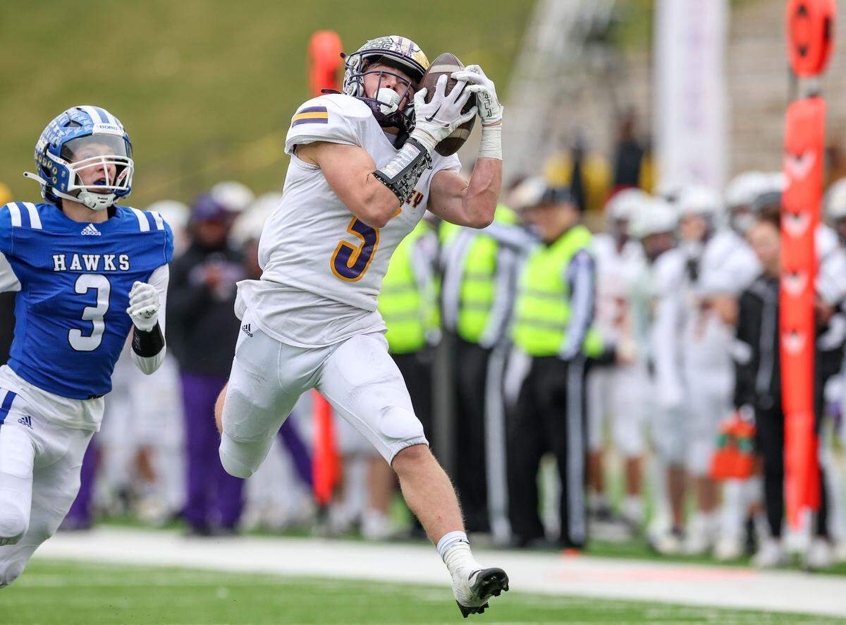 Kearney’s Cohen Jacobs hauls in a 47-yard touchdown pass during the Bulldogs’ 68-28 Show-Me Bowl rout of Hillsboro on Saturday at Faurot Field in Columbia.