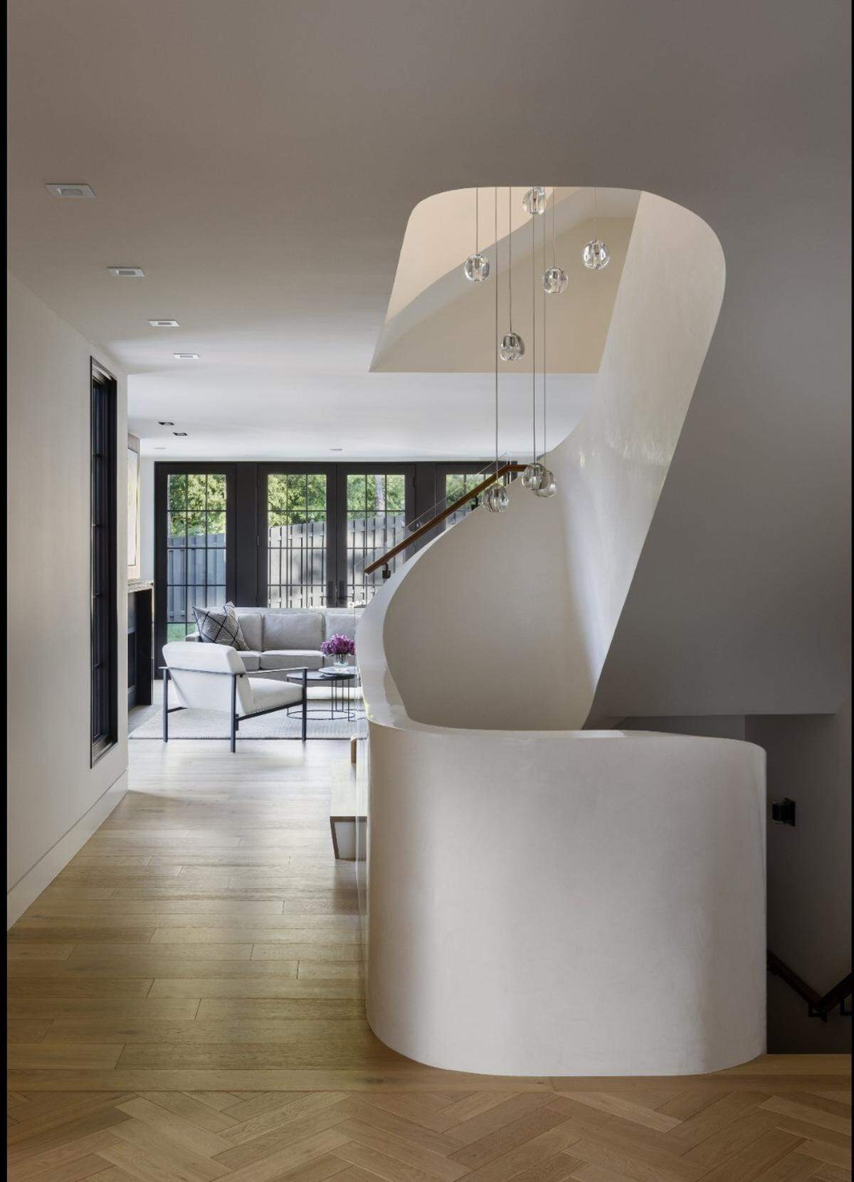 The staircase inside the revitalized Mission Hills mansion was inspired by the Guggenheim, an art museum in New York City.