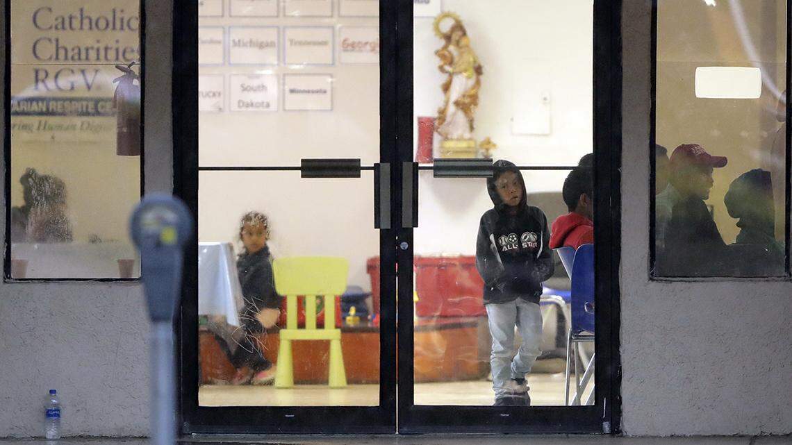 Immigrants recently processed and released by U.S. Customs and Border Protection wait at a Catholic Charities facility on June 20 in McAllen, Texas.