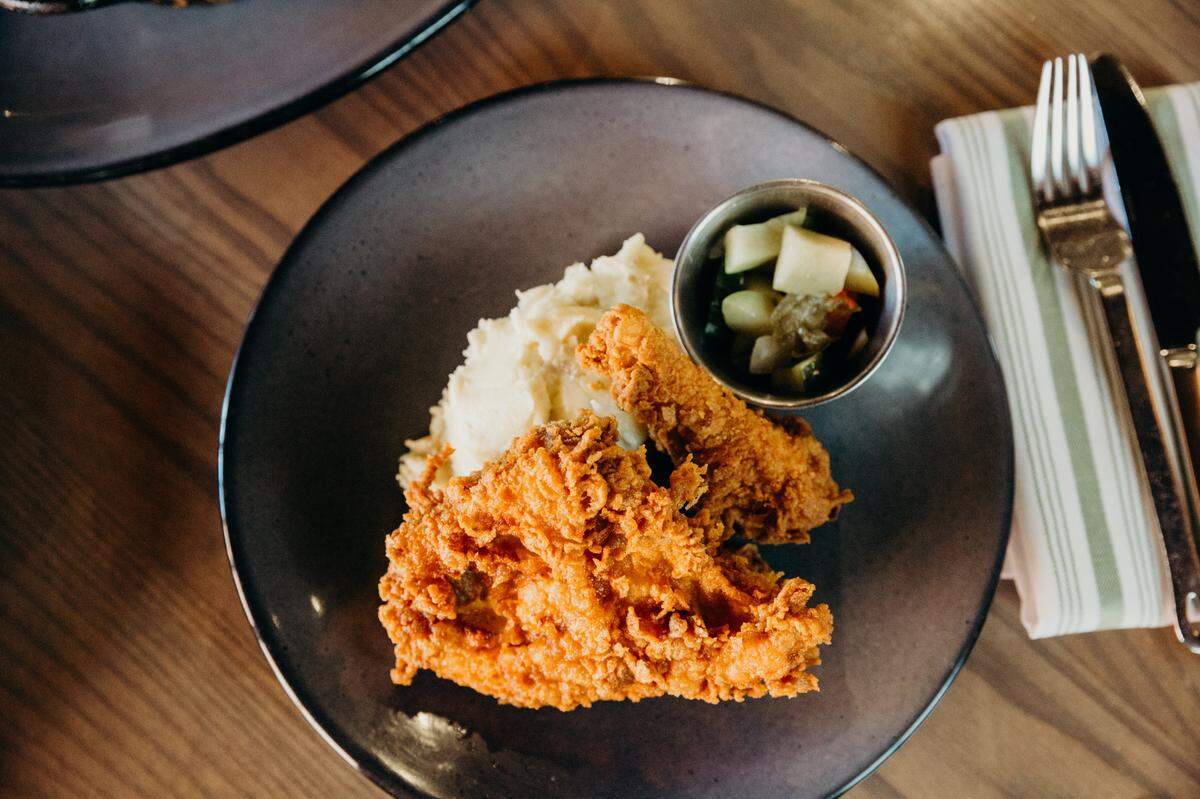 Third Street Social’s fried chicken with a side of mashed Yukon Gold potatoes and pickled vegetables