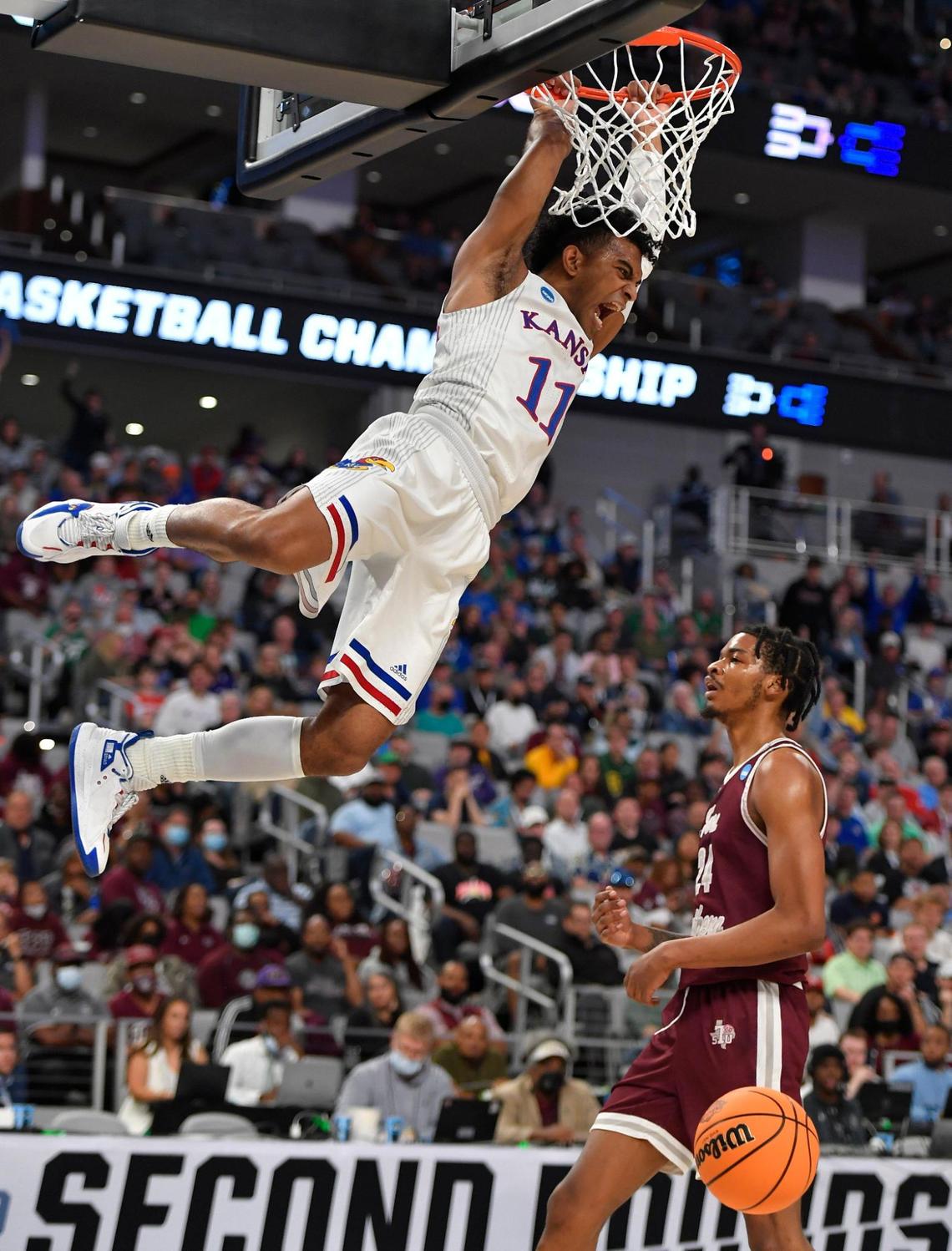 KU’s Remy Martin threw down a monster dunk over Texas Southern’s John Walker off a fast break during the first half of Thursday night’s first round NCAA Tournament game in Fort Worth.