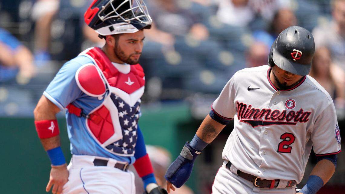 Minnesota’s Luis Arraez scores in the third inning as Kansas City Royals catcher Sebastian Rivero, left, looks on Sunday at Kauffman Stadium.