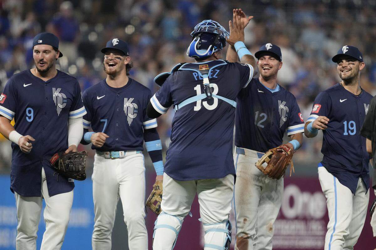 Vinnie Pasquantino (from left), Bobby Witt Jr., Salvador Perez, Nick Loftin and Michael Massey of the Kansas City Royals celebrate a 6-0 win over the Chicago Cubs at Kauffman Stadium on July 26, 2024 in Kansas City.