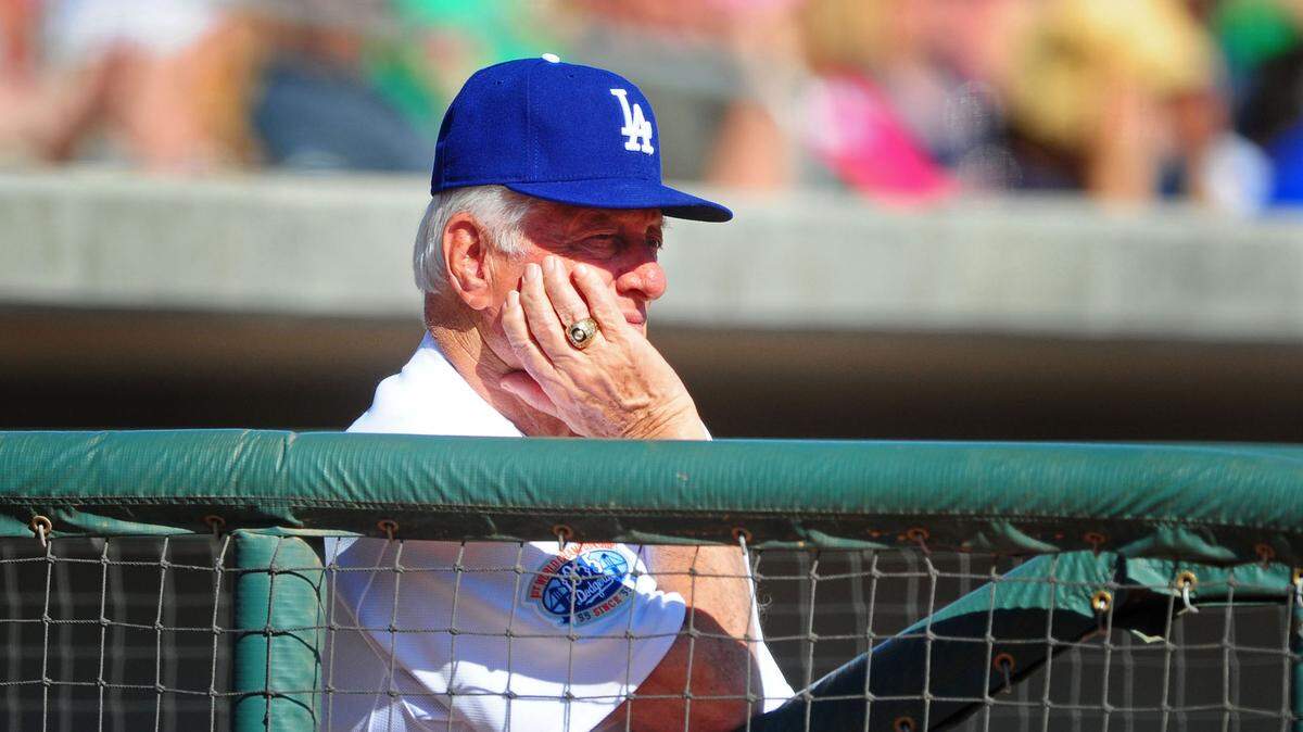Mar. 12, 2010; Glendale, AZ, USA; Los Angeles Dodgers coach Tommy Lasorda bats against the Cincinnati Reds at The Ballpark at Camelback Ranch. Mandatory Credit: Mark J. Rebilas-USA TODAY Sports