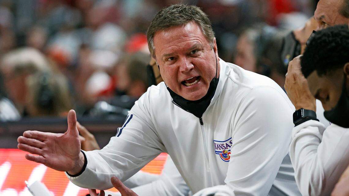 Kansas coach Bill Self talks to his team on the bench during the first half of an NCAA college basketball game against Texas Tech, Saturday, Jan. 8, 2022, in Lubbock, Texas. (AP Photo/Brad Tollefson)