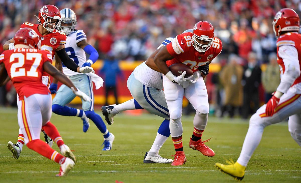 Kansas City Chiefs defensive tackle Chris Jones recovers a fumble by Dallas Cowboys quarterback Dak Prescott in the first quarter Sunday, November 21, 2021, after Prescott was sacked by Chiefs defensive end Frank Clark.