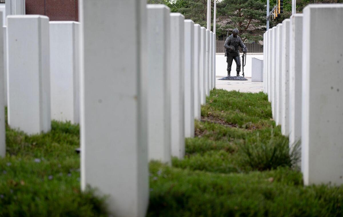 A statue of a soldier paying respect at a fellow soldier’s grave is part of this memorial.