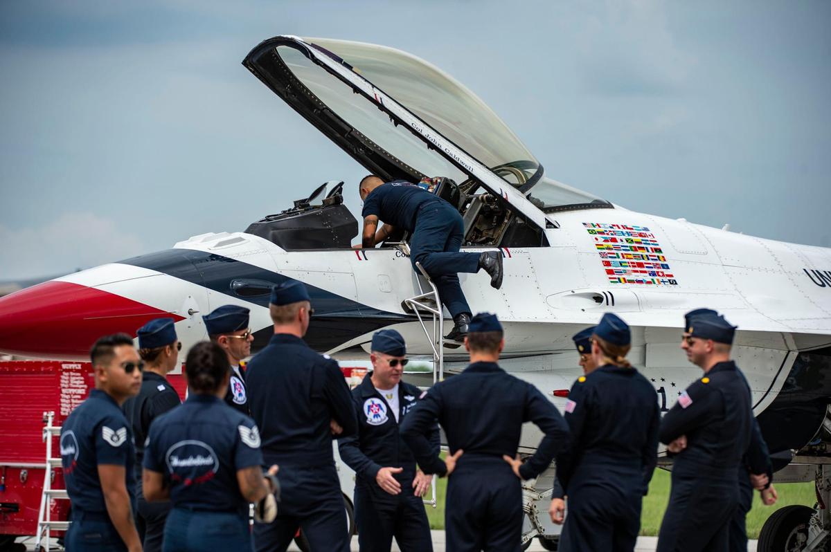 The United States Air Force Thunderbirds group up and talk, Thursday, July 1, 2021, at New Century AirCenter near Gardner, Kan. The Thunderbirds arrived to fly in the KC Air Show this weekend.
