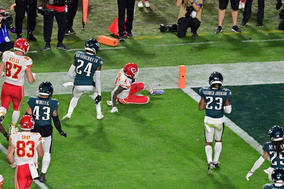 Kansas City Chiefs running back Jerick McKinnon (1) slides to stop the clock during the fourth quarter of Super Bowl LVII against the Philadelphia Eagles at State Farm Stadium.