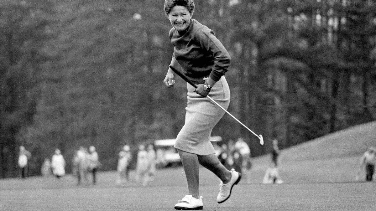 Marilynn Smith watches her ball hang on rim of cup for 3 minutes, stomps the ground as ball finally drops, at Augusta, Ga., during the Women’s Titleholders Golf Tourney, April 27, 1964. This gave her a 4 on the 10th hole and Mickey Wright a 5. She beat Mickey by only one stroke to win the event. (AP Photo/Horace Cort)