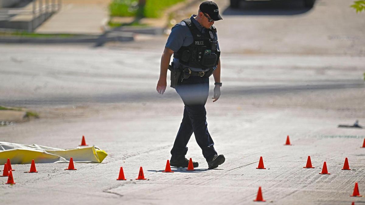 Evidence markers filled the street as police were investigating the scene after three people died and five were injured following a shooting early Sunday, June 25, 2023, near 57th Street and Prospect Avenue in Kansas City.
