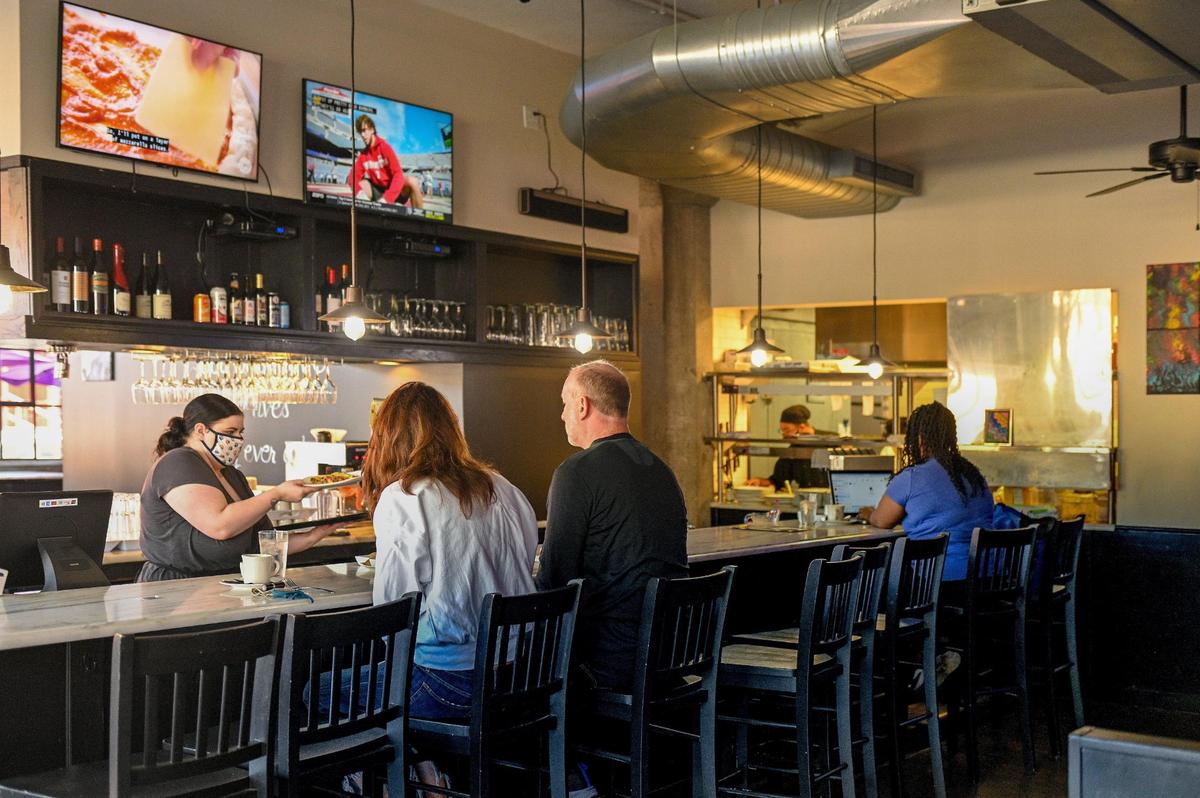 Diners sit at the bar for brunch at Foodlove Cafe, 2101 Broadway Blvd.