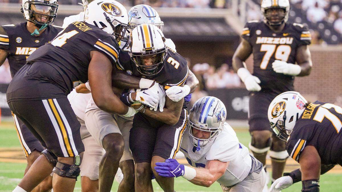 Missouri Tigers wide receiver Luther Burden III (3) is tackled by Middle Tennessee Blue Raiders safety Tra Fluellen (17) during the first half at Faurot Field at Memorial Stadium on Sept. 9, 2023.