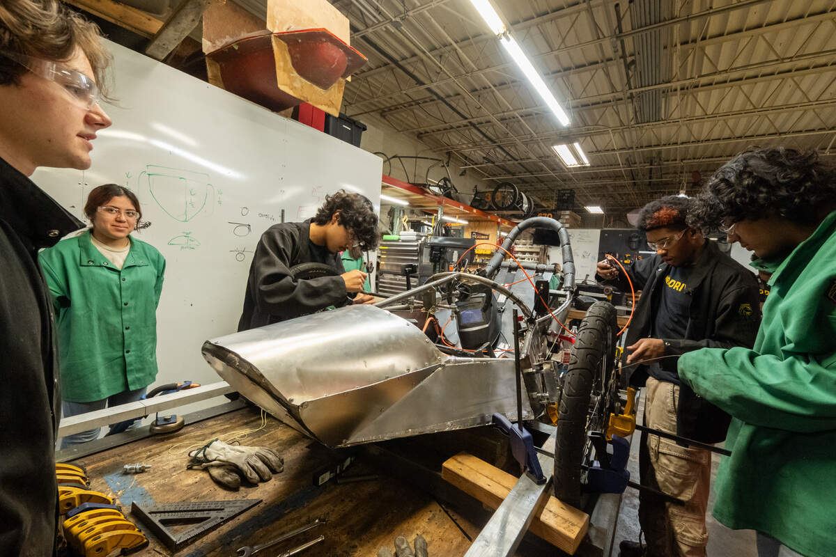 Students construct a race car from scratch at the MINDDRIVE Headquarters in Kansas City. The program works with teens from across the metro as they develop engineering and fabrication skills.