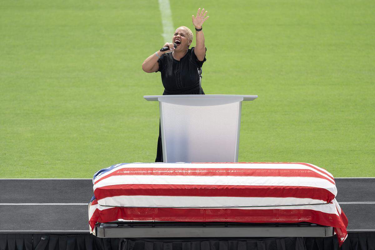 Rev. Rochelle Settle performs "Take Me to the King" during the funeral for Deputy Elijah Ming at Children's Mercy Park on Monday, Aug. 11, 2025, in Kansas City, Kansas