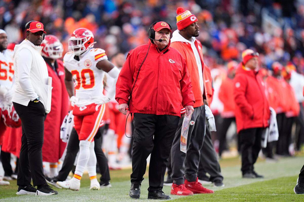With defensive line star Chris Jones right behind him, Kansas City Chiefs coach Andy Reid watches his team’s NFL Week 18 game against the Broncos at Empower Field at Mile High in Denver on Sunday, Jan. 5, 2025.