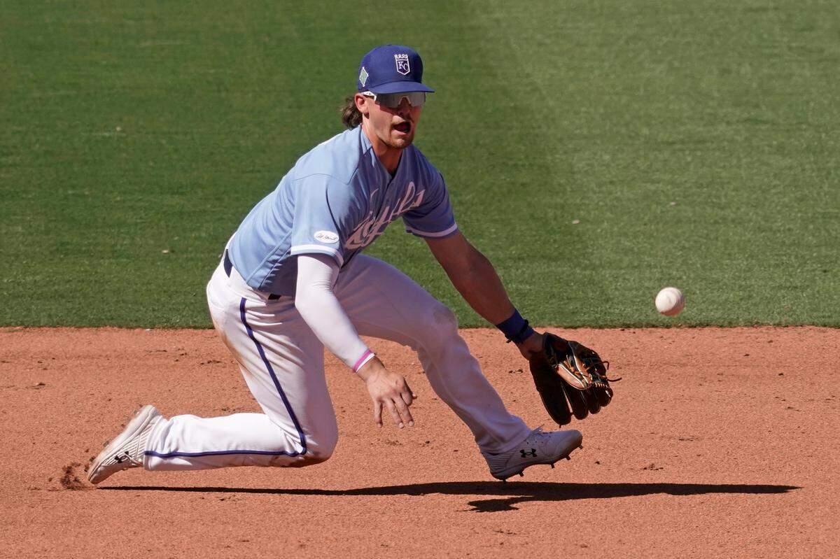 Kansas City Royals third baseman Bobby Witt Jr. fields a ball during the sixth inning of a spring game against the Cincinnati Reds in Surprise, Ariz.