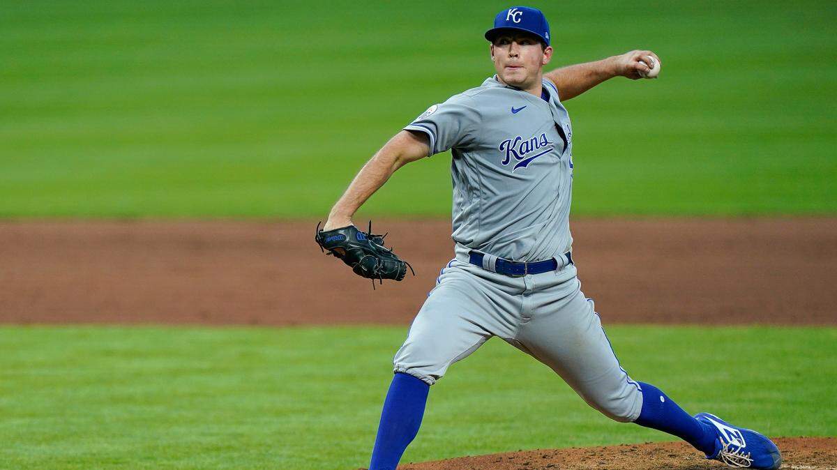 Kansas City Royals starting pitcher Kris Bubic throws during the fifth inning of the team;s baseball game against the Cincinnati Reds in Cincinnati, Tuesday, Aug. 11, 2020. (AP Photo/Bryan Woolston)