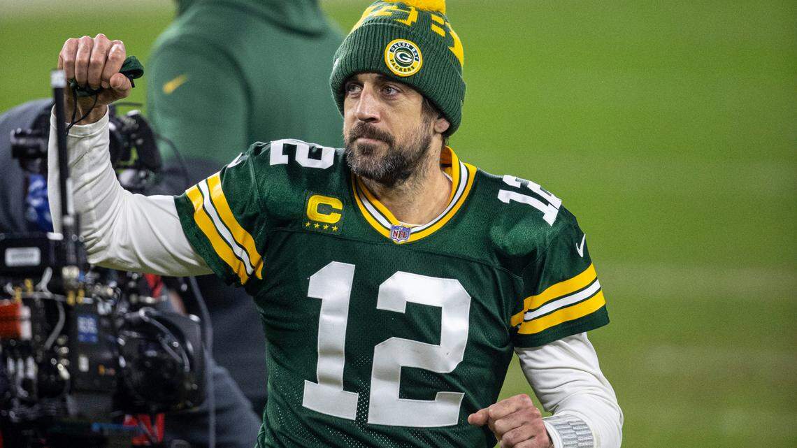 Green Bay Packers quarterback Aaron Rodgers (12) reacts after an NFL divisional playoff football game between the Los Angeles Rams and Green Bay Packers, Saturday, Jan. 16, 2021, in Green Bay, Wis. (AP Photo/Jeffrey Phelps)