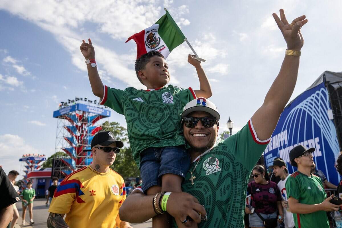 Mexico fans cheer and dance while watching Sin Tope perform at the FIFA Fan Festival on Thursday, June 11, 2026, in Kansas City.