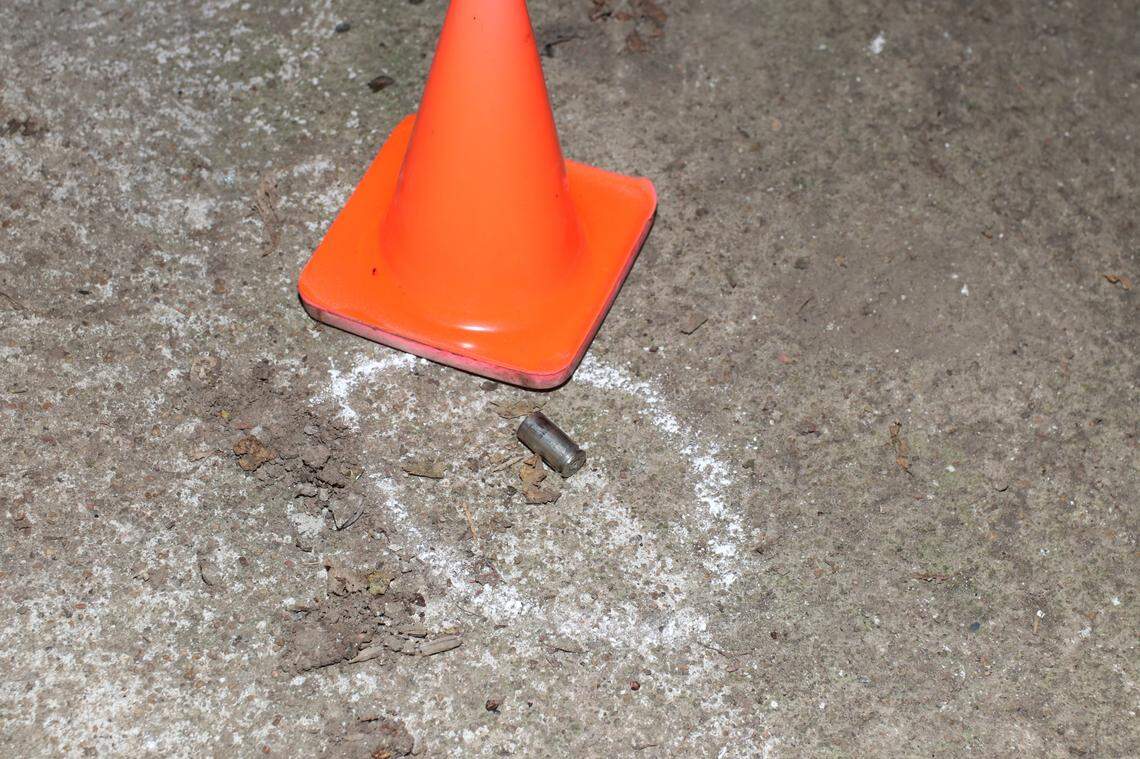 A cone marking a shell casing is shown in a crime scene photo from the police shooting of Cameron Lamb in Kansas City.