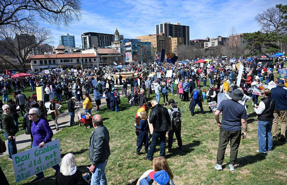 Protesters gathered in Mill Creek Park near the Country Club Plaza on Saturday, March 28, 2026, in Kansas City for a No Kings protest against the Trump administration.