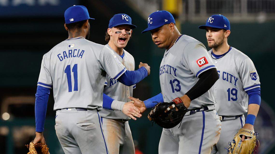 Kansas City Royals third baseman Maikel Garcia (11), shortstop Bobby Witt Jr. (7), captain Salvador Perez (13) and second baseman Michael Massey (19) celebrate after a game against the Washington Nationals at Nationals Park.