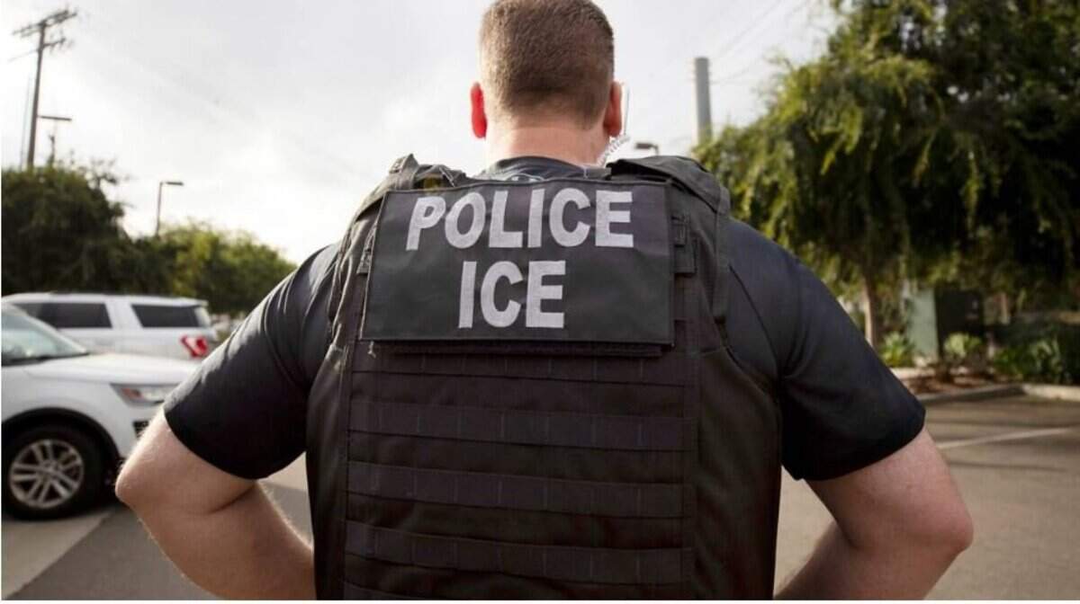 A U.S. Immigration and Customs Enforcement (ICE) officer looks on during an operation in Escondido, Calif., July 8, 2019.