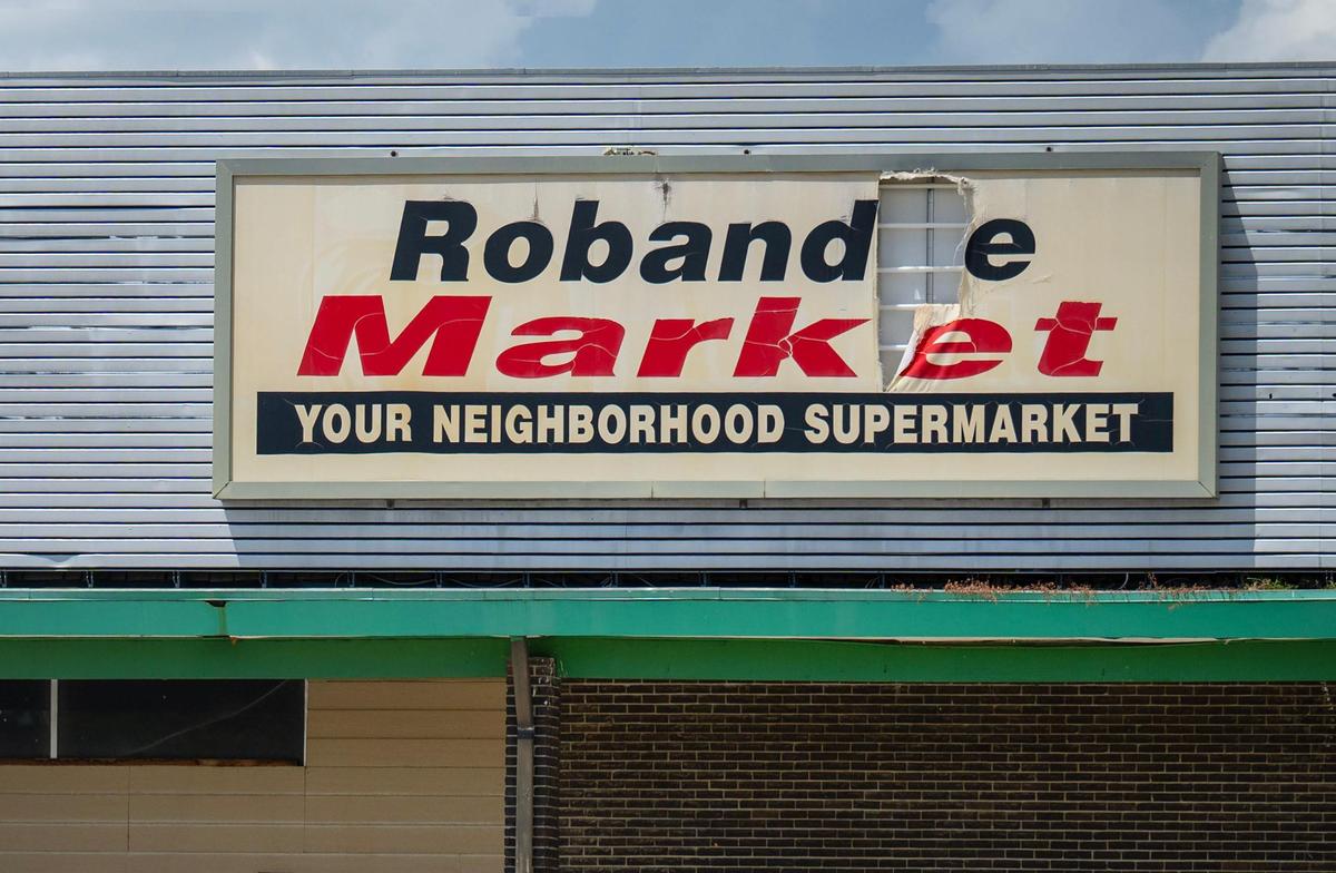 The marquee sign from the Robandee Market still hangs on the long vacant, dilapidated supermarket at Robandee Shopping Center, 8300 E. Bannister Rd., in Kansas City on Monday, July 7, 2025.