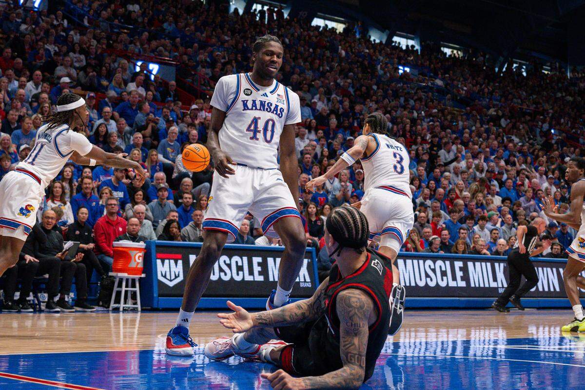 Kansas Jayhawks forward Flory Bidunga (40) stares down Utah Utes guard Terrence Brown (2) after blocking his shot in the second half on Saturday, February 7, 2026, at Allen Fieldhouse.