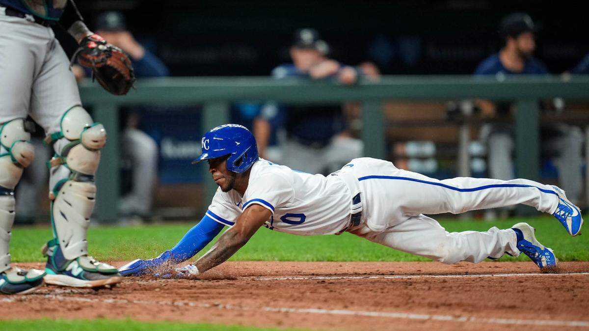 Royals second baseman Samad Taylor slides into home to score the winning run on a bunt by left fielder Dairon Blanco (not pictured) against the Seattle Mariners Monday night at Kauffman Stadium.