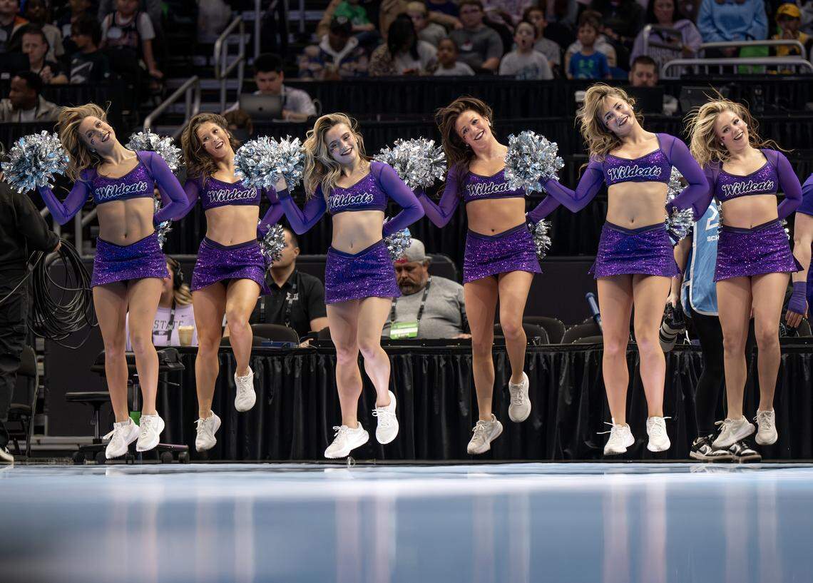 Kansas State Wildcats cheerleaders jump in unison during a timeout in the fourth quarter of a game between the Kansas State Wildcats and the Texas Tech Red Raiders in the Big 12 Women's Basketball Tournament at T-Mobile Center on Thursday, March 5, 2026, in Kansas City.