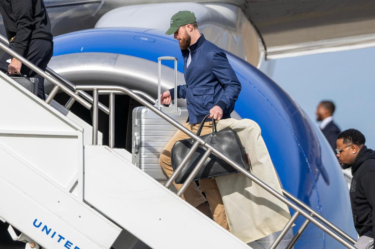 Kansas City Chiefs kicker Harrison Butker boards a United Airlines flight with teammates from Kansas City International Airport on Sunday, Feb. 2, 2025, traveling to New Orleans for Super Bowl LIX.
