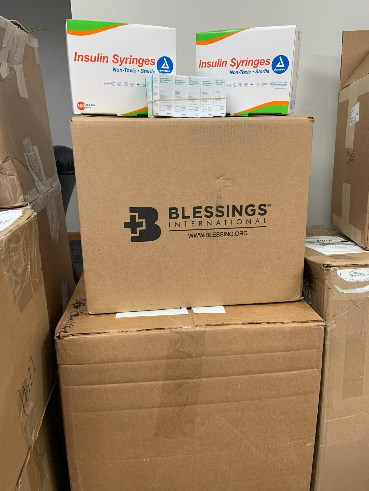 Packages of insulin and syringes sit in the hall of Global Care Force headquarters in Olathe. The boxes will be shipped to Ukraine on Tuesday.