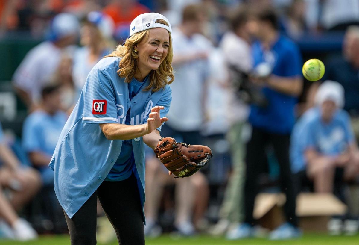 Sarah Tiana, comedian, writer, catches the ball during the Big Slick Celebrity Softball game on Friday, May 30, 2025, at Kauffman Stadium in Kansas City.
