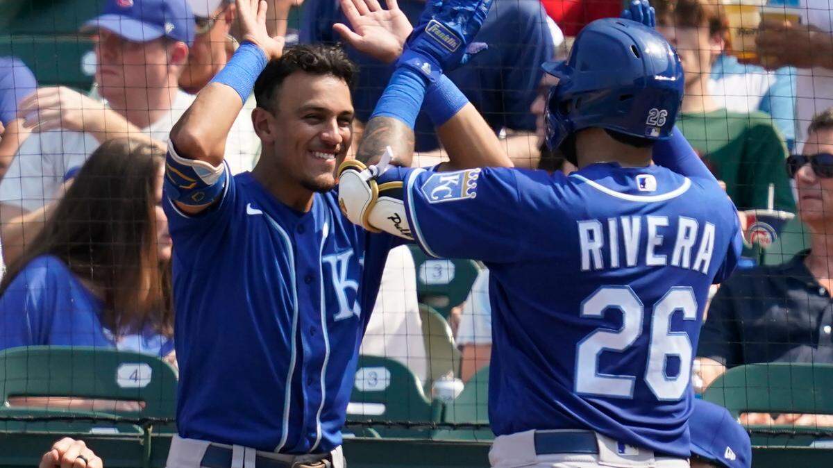 Kansas City Royals’ Emmanuel Rivera (right) celebrates with Nicky Lopez after Rivera hit a solo home run in the fifth inning against the Chicago Cubs, Friday, Aug. 20, 2021, at Wrigley Field in Chicago.