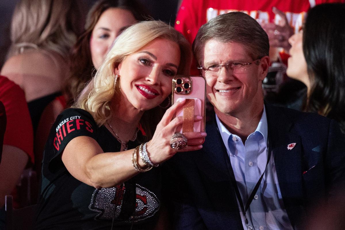 Tavia Hunt takes a selfie with her husband, Kansas City Chiefs owner and CEO Clark Hunt, Tuesday at the 13th Annual Chiefs Style Lounge at The LEX in downtown Kansas City.