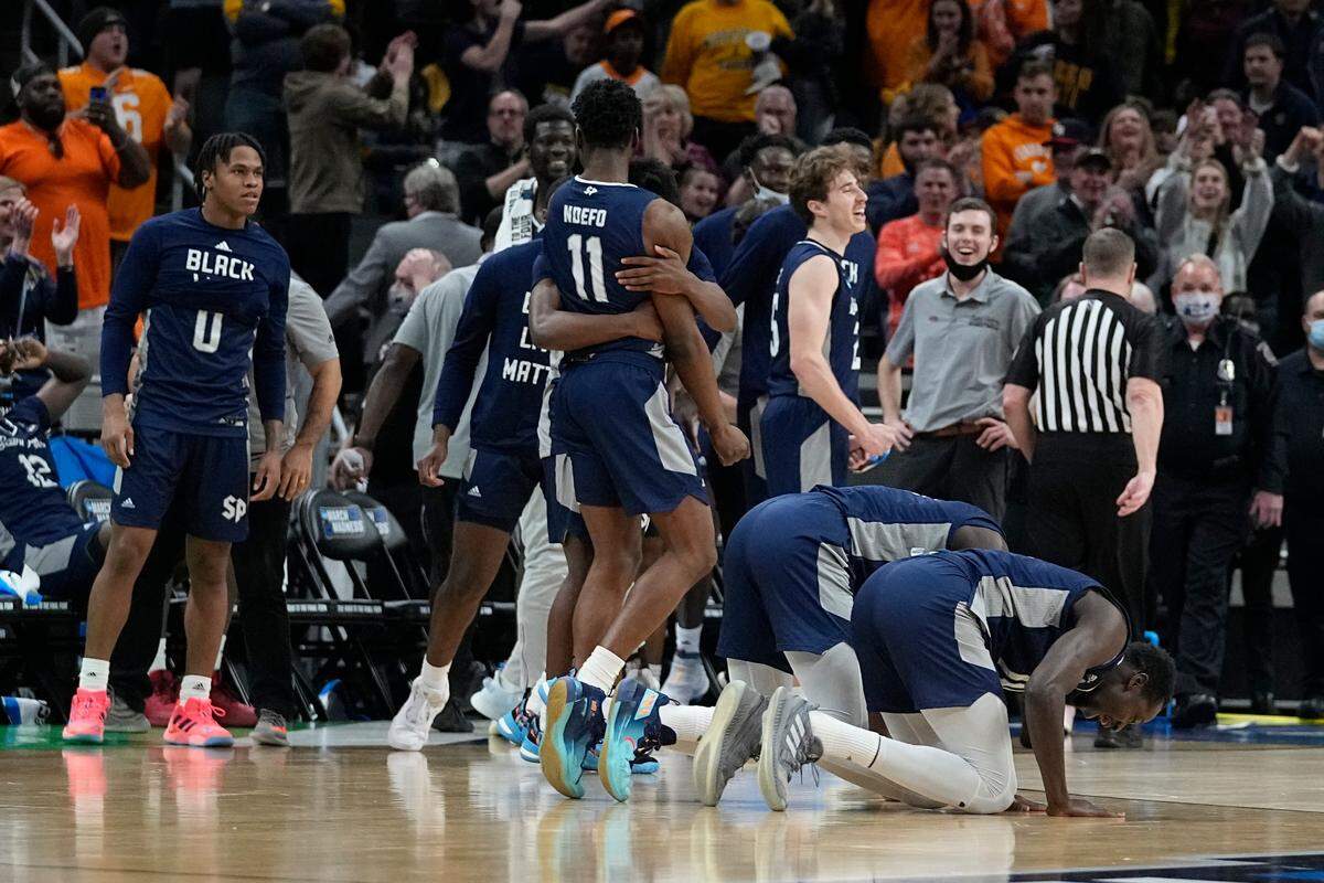 Saint Peter’s players celebrate after defeating Murray State in a college basketball game in the second round of the NCAA tournament, Saturday, March 19, 2022, in Indianapolis. (AP Photo/Darron Cummings)