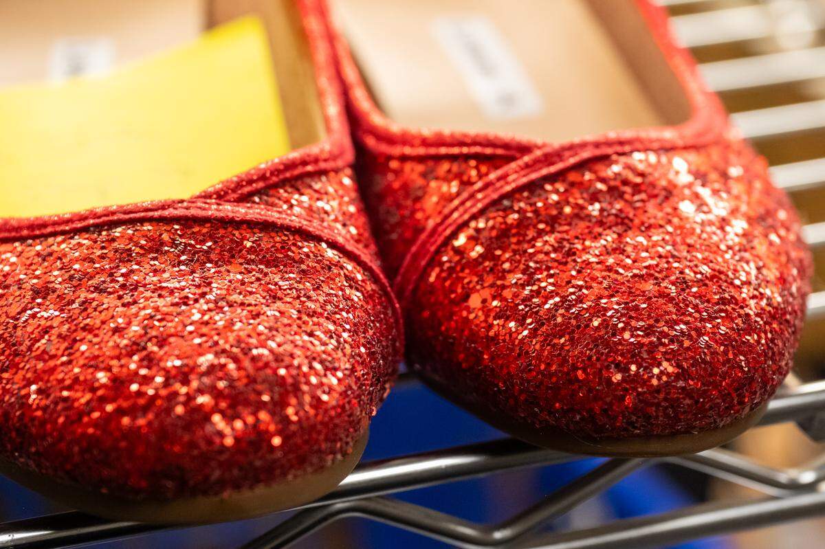 Ruby red slippers sit on a shelf in preparation for Kansas City Repertory Theater’s rendition of ‘The Wizard of Oz,’ on Tuesday, April 28, 2026. The reimagining of the classic tale will feature costume designs from Sully Ratke.
