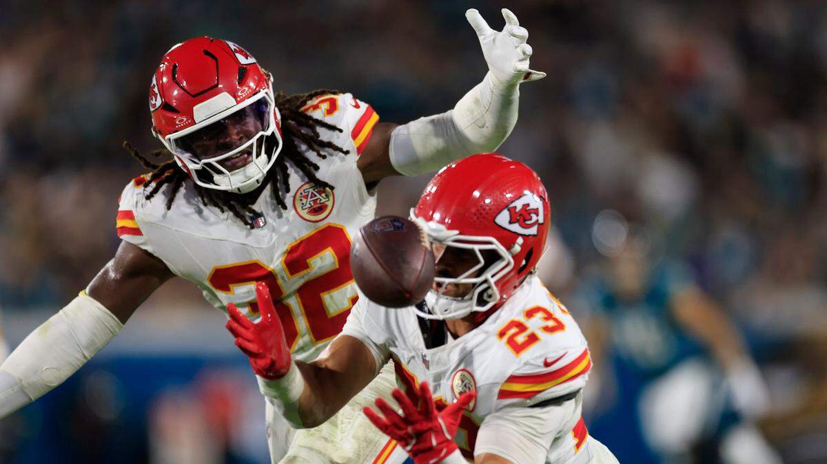 Kansas City Chiefs linebackers Nick Bolton (No. 32) and linebacker Drue Tranquill (No. 23) can’t intercept a bobbled pass during an NFL game against the Jaguars at EverBank Stadium in Jacksonville, Florida on Monday, Oct. 6, 2025.