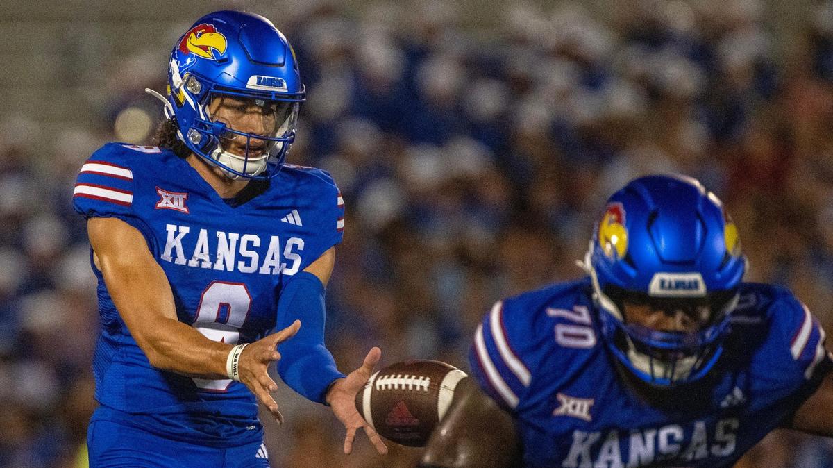 Kansas Jayhawks quarterback Jason Bean (9) takes the snap in the second quarter during the season opener against the Missouri State Bears at David Booth Kansas Memorial Stadium on Friday, Sept. 1, 2023, in Lawrence, Kan.